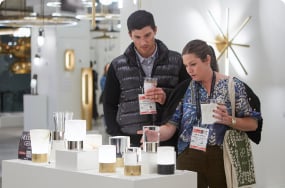 two people looking at golder wares